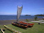 Captain Kiko's double canoe amoung other canoes