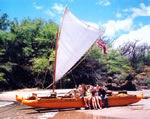 group on the double canoe beached